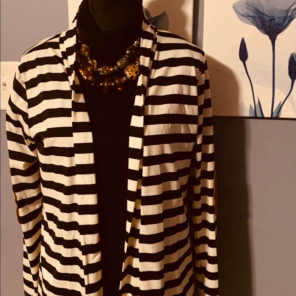 Angvns Jacket
White with Black Horizontal strips . Brown suede elbow . Size XL.
